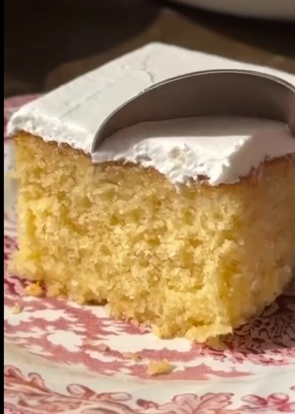 Whip sour cream, instant pudding, powdered sugar, and milk until thick; spread over cooled cake.
