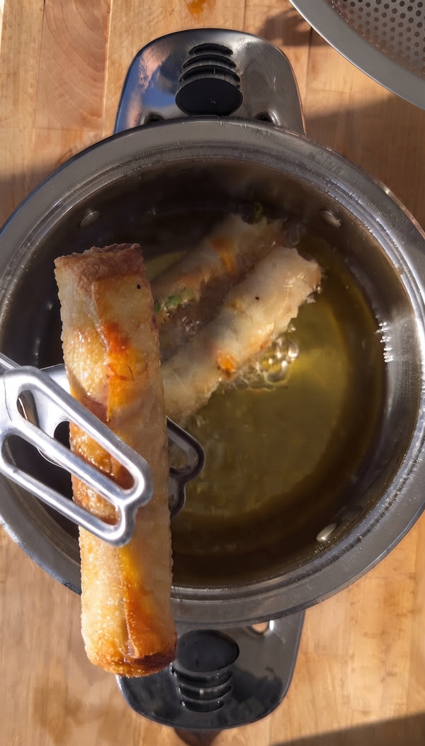 Present the golden, ultra-crispy Asian eggrolls wrapped in rice
paper and served with a tangy-spicy dipping sauce, looking like a million bucks with zero effort.