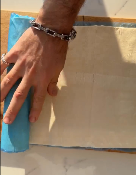Unroll the puff pastry sheet. Spread the rich cheese filling evenly down the center or roll into a long spiral log.
