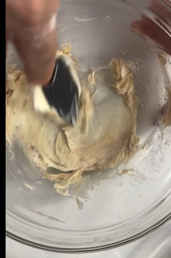 Beat soft butter and powdered sugar for 2–3 minutes until pale and fluffy. Beat in 1 whole egg and 1 egg white (setting yolk aside for egg wash). Mix in almond meal, flour, vanilla, and Amaretto until creamy. Refrigerate for 30 minutes to set.