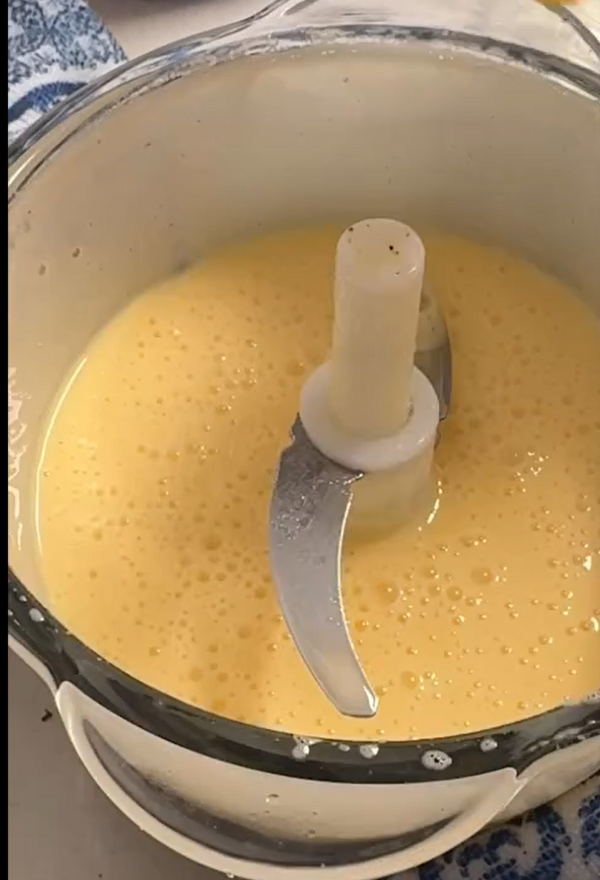 Pulse eggs and sugar in a food processor until pale. Pulse in oil, orange juice, and zest. Add semolina, almond flour, and flour; pulse briefly until smooth