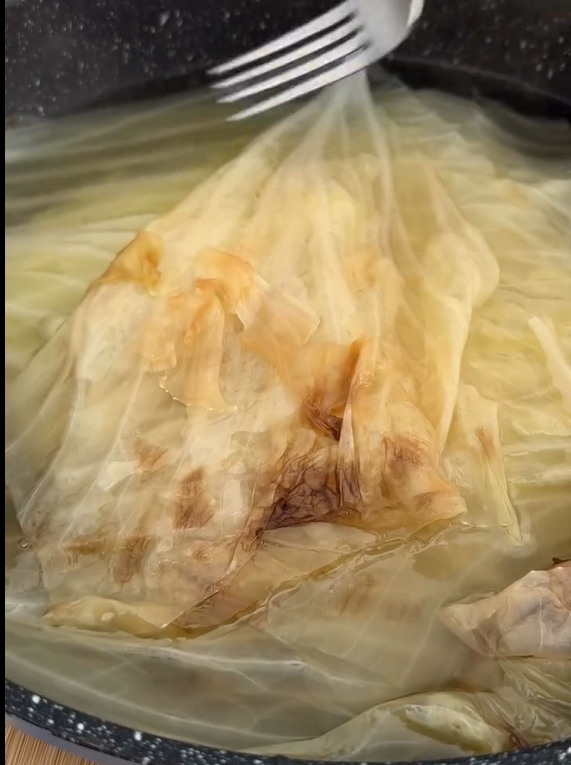 Trim the stem of the cabbage. Boil whole in hot water for
8–10 minutes until leaves soften and separate easily.