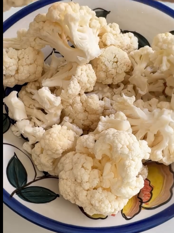 Pulse raw cauliflower florets in a food processor until they reach a fine, couscous or rice-like texture. Transfer to a large mixing bowl.