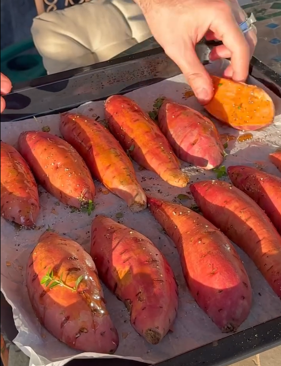 Wash and slice the sweet potatoes in half lengthwise. Score the skin/flesh lightly with a knife.