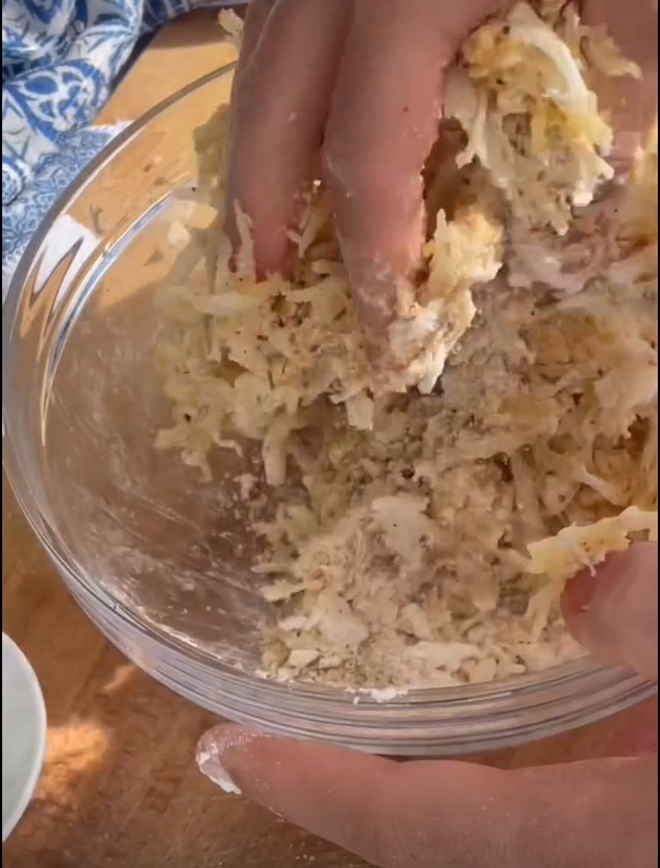 Grate potatoes and onion into a kitchen towel and squeeze out all excess liquid until completely dry.