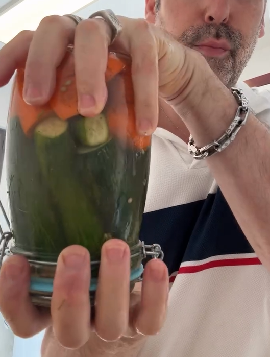 Pour warm brine over vegetables until completely submerged. Seal jar tightly.