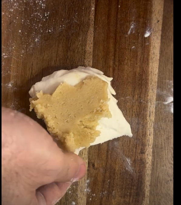 Place a generous dollop of almond cream at the wide base of each triangle stack. Roll into traditional croissant shape.