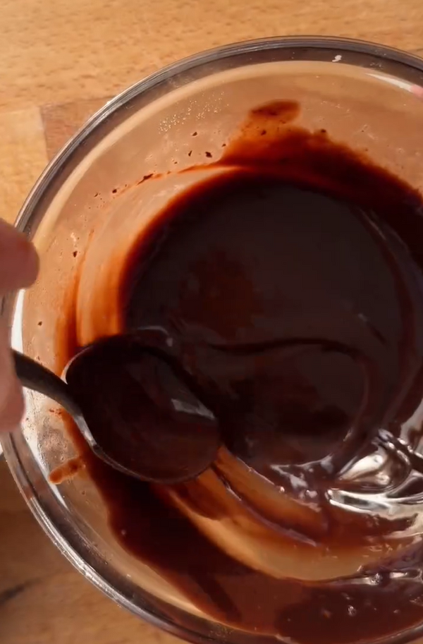 Melt dark chocolate with coconut oil in the microwave in 30- second bursts (or over a double boiler) until smooth. Pour the chocolate over the banana layer and spread gently with a spatula to coat completely.