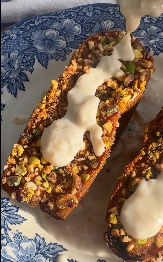 Flip sweet potatoes skin-side down on a serving platter. Generously drizzle with creamy tahini.