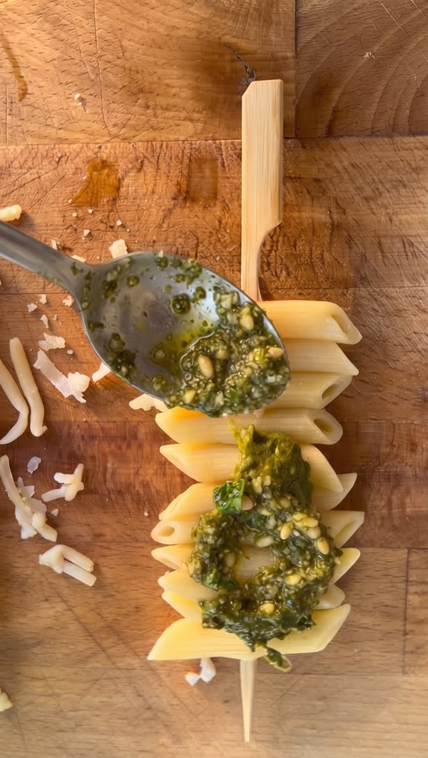 Spread tomato sauce or pesto over each skewer and top with the cheese blend and fresh basil.