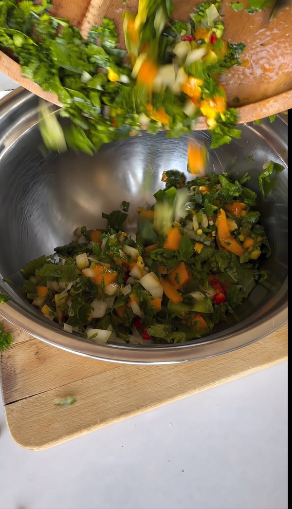 Pour the magic dressing over the prepared salad ingredients and
mix gently using hands or a wooden spoon.