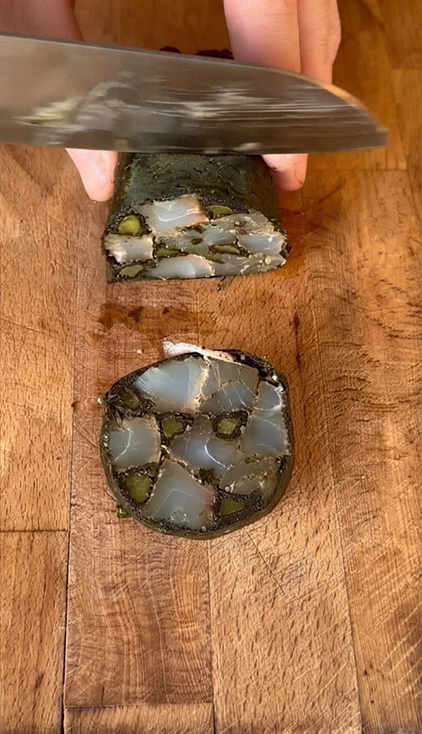 Cook the wrapped roll in water at ~45°C (or
low-medium induction) for 25 minutes, chill completely, slice into 2 cm rounds with a
sharp knife, and serve over green curry coconut sauce.