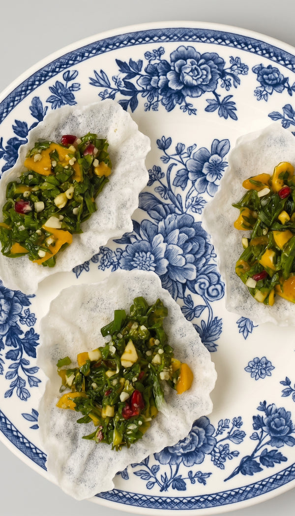 Present the colorful, refreshing Thai mango
salad paired with crispy rice paper crackers, looking like a million bucks with zero effort.