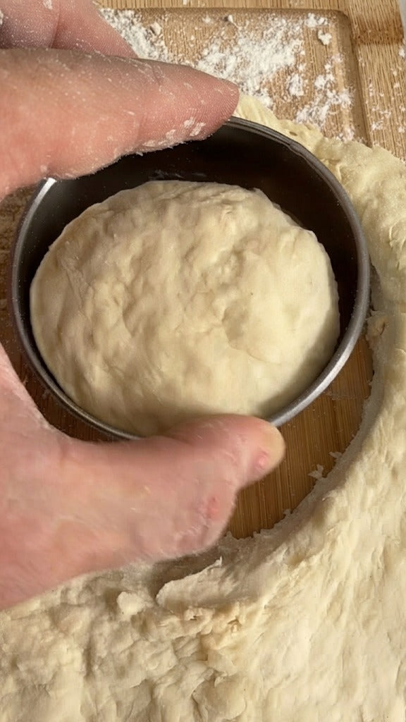 Divide the dough into 6–8 equal balls and shape into smooth round buns.