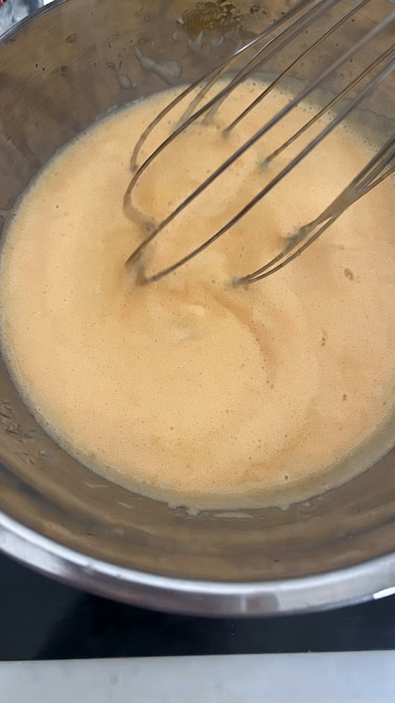 Place the bowl over the simmering water and whisk constantly until thick and creamy.