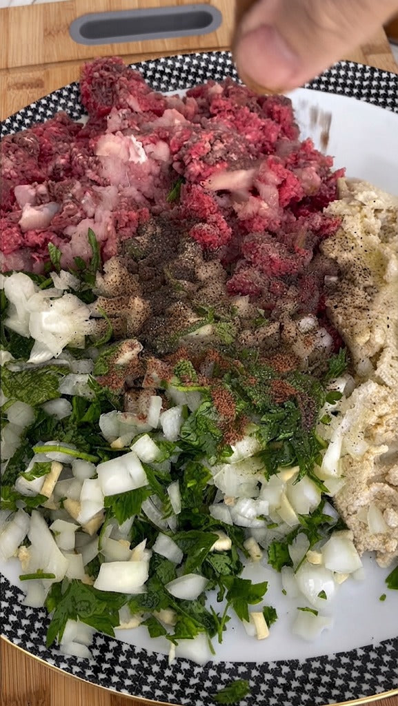Combine dough ingredients with meat, herbs, and spices. Shape into uniform dumplings with wet hands and bake at 180°C for 20 minutes to firm up.