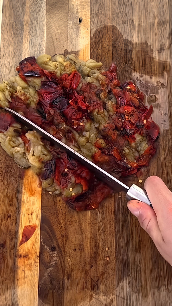 Gently mix in a fresh squeezed tomato
along with all the seasoned vegetables until well combined.