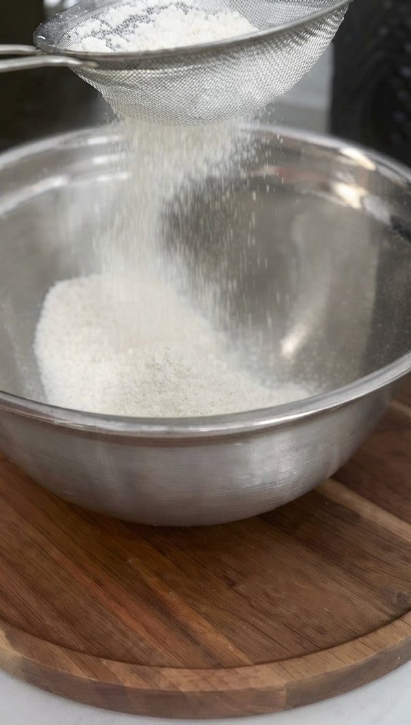 Start by placing granulated sugar into a mixing bowl, which will be used to infuse the citrus zest.