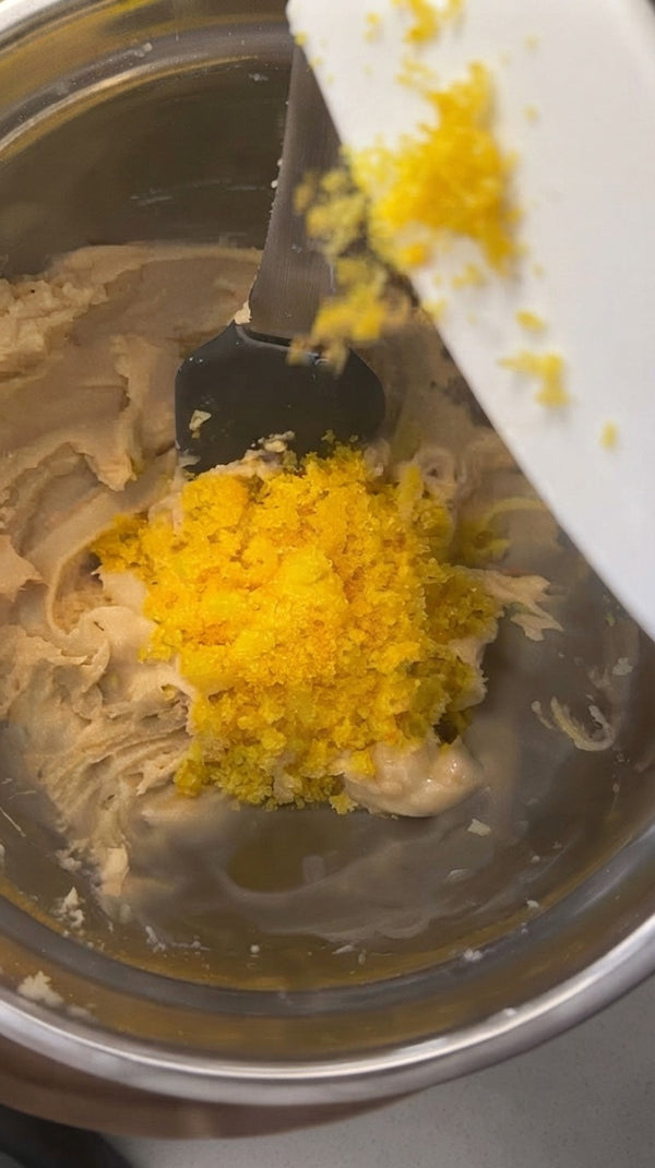 Add this aromatic citrus sugar into the cake batter or base mixture, folding it in gently with a spatula.