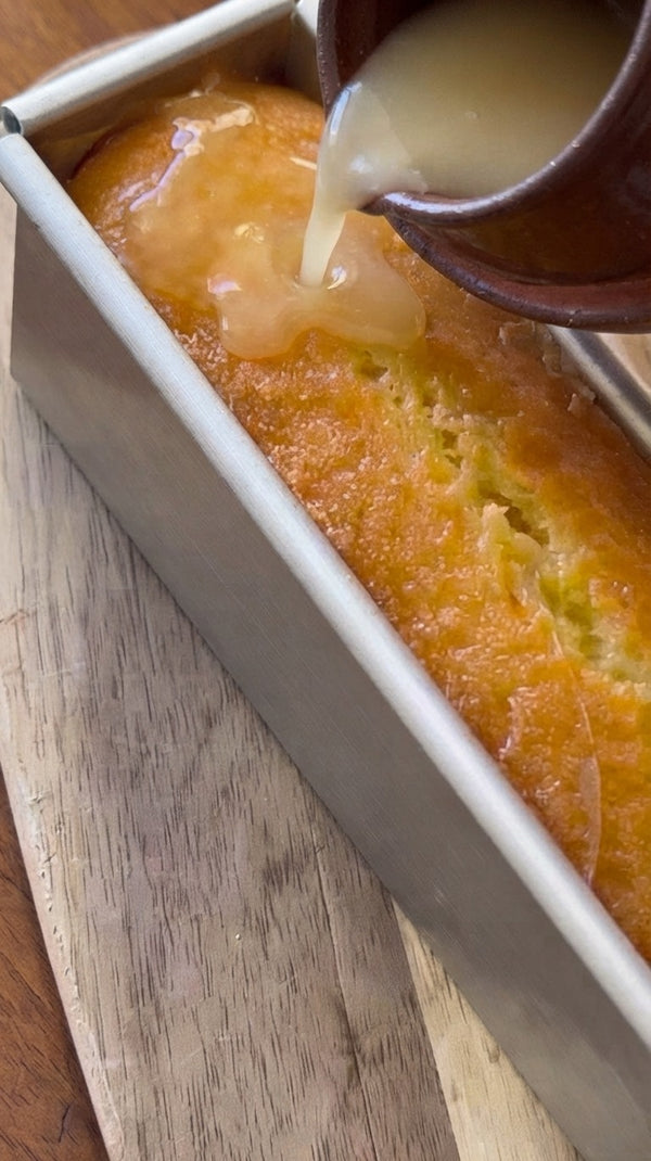 Once the cake has finished baking, pour a warm citrus syrup or glaze over the top so the cake absorbs it, becoming thoroughly moist and flavorful.
