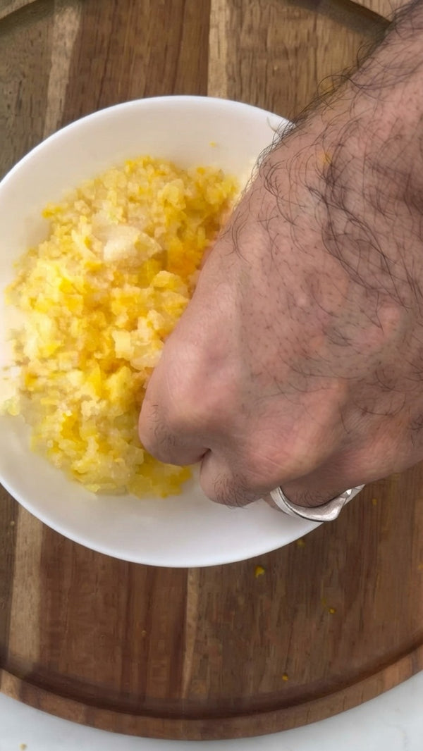 Grate fresh citrus fruit on a fine grater to prepare additional fresh zest, giving the cake an authentic citrus punch.