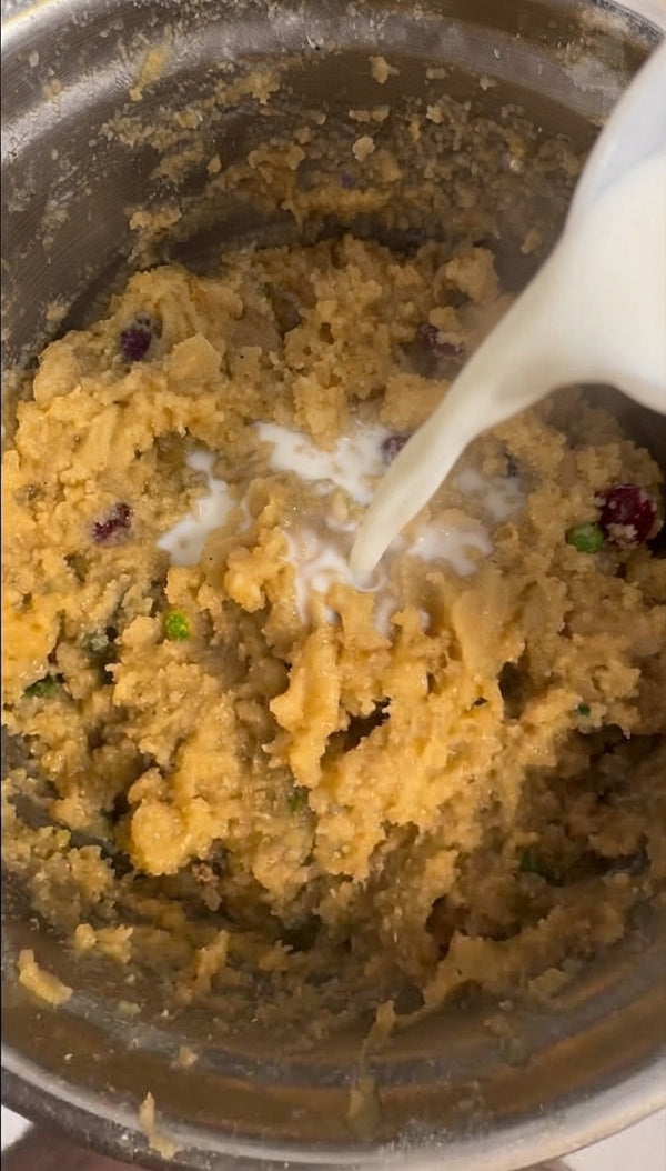 Pour in milk or other liquids to bring the dough together.