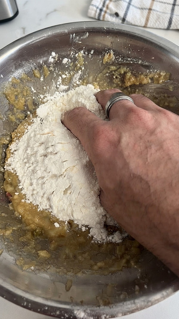 Combine and work the ingredients together by hand.