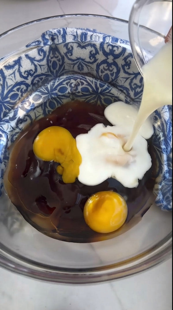 Add liquids, such as milk or cream, directly into the bowl with the eggs and base mixture.