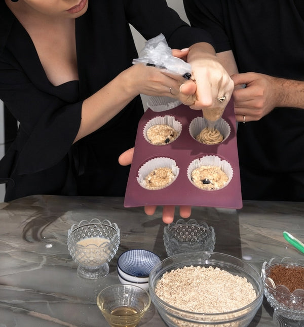 Spoon or pipe the prepared batter evenly into the cups of a silicone muffin mold