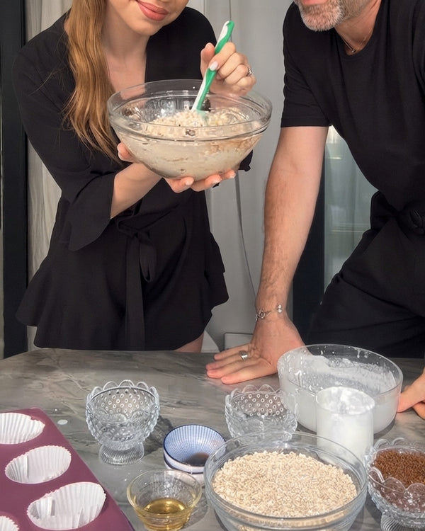 Whisk together wet ingredients, including milk, oil, and liquid components, in a glass bowl.