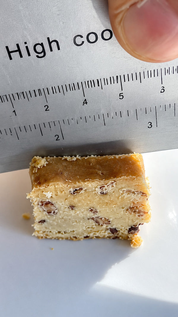 Carefully pipe the cream onto the prepared surface, creating an even and decorative layer.