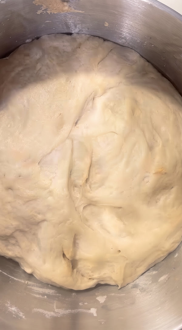 Combines semolina and riced potato. In a large mixing bowl, combine Tipo 00 flour and fine semolina. Add fresh yeast, mashed boiled potato, extra virgin olive oil, water, and salt.