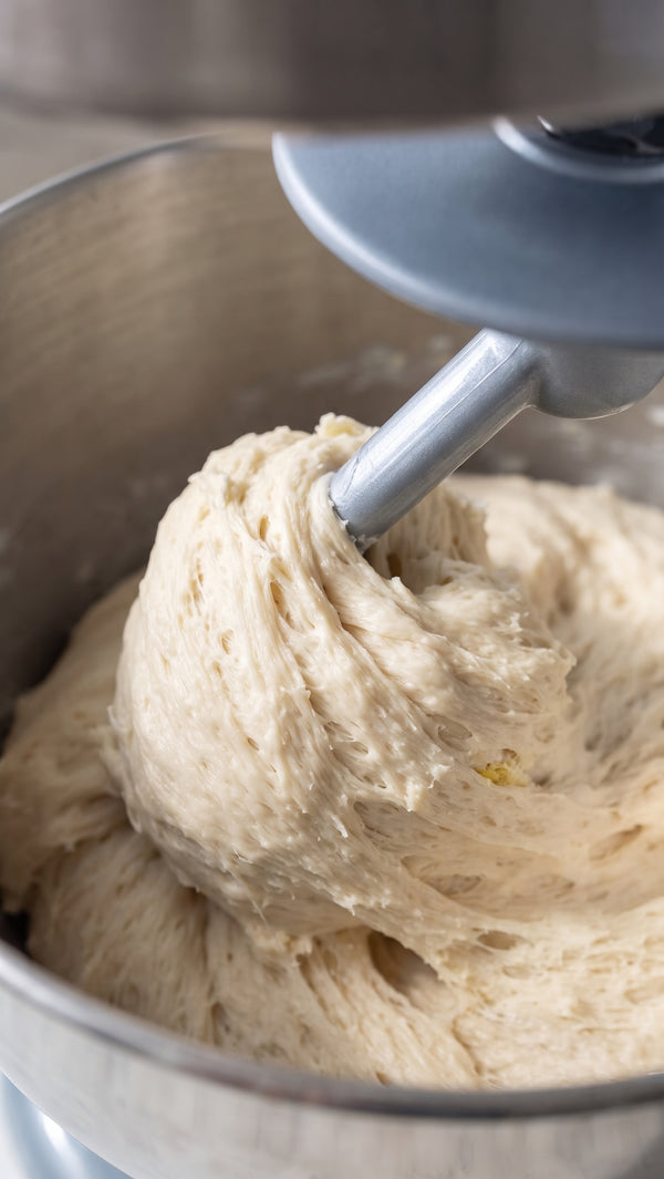 Develops light, airy structure. Knead the dough for approximately 10 minutes until soft, smooth, and slightly sticky. Cover with a damp cloth and let proof at room temperature for 2 hours until doubled in size.