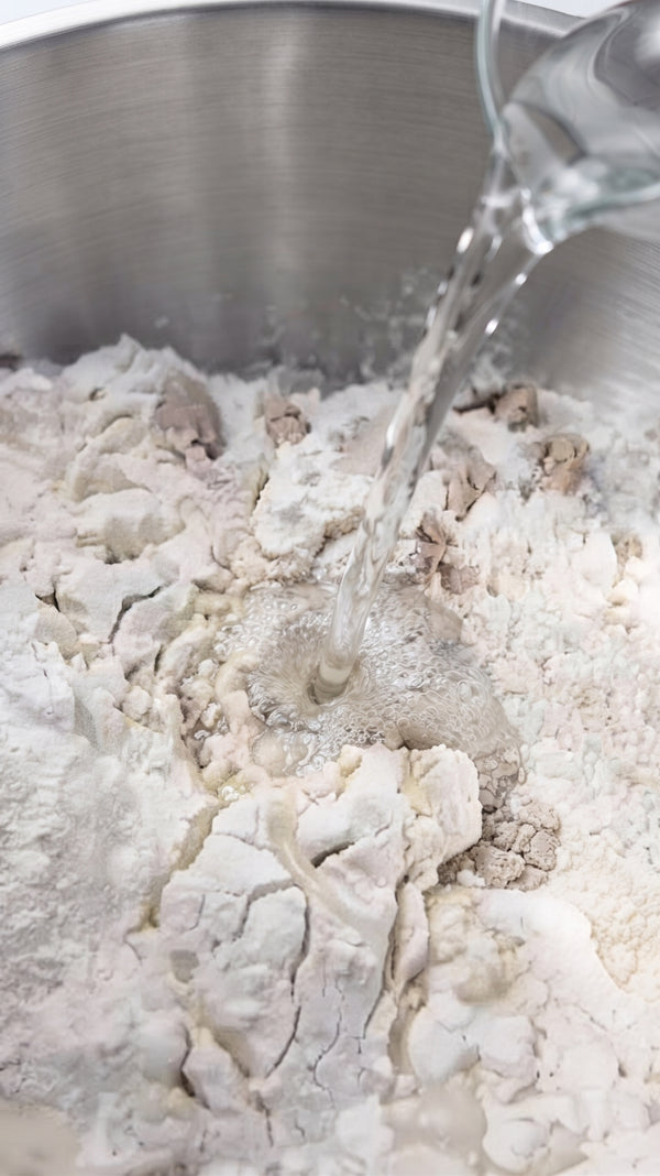 Crucial for crispy bottom crust. Generously oil a deep baking pan or cast-iron skillet with olive oil. Transfer the risen dough into the pan and gently stretch it with oiled fingers to cover the bottom.
