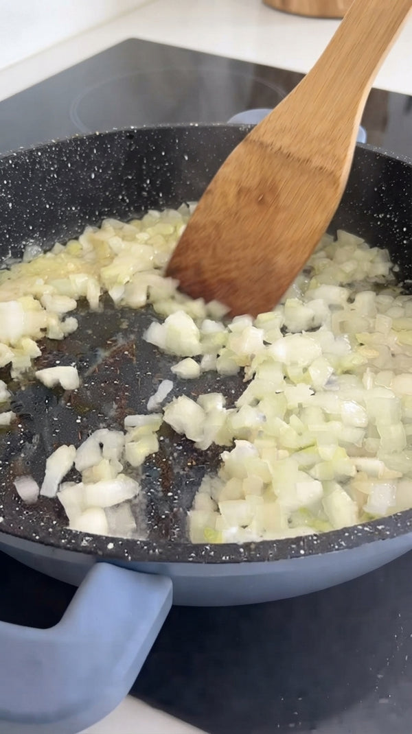 Heat olive oil in a wide, heavy-bottomed skillet or Dutch oven over medium-high heat. Season chicken quarters with salt and pepper. Place skin-side down and sear for 6-8 minutes until deeply golden brown. Flip and sear the other side for 3-4 minutes. Remove chicken temporarily.