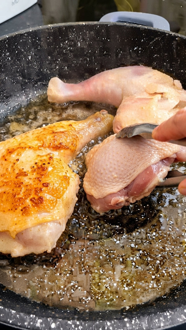 Heat olive oil in a wide, heavy-bottomed skillet or Dutch oven over medium-high heat. Season chicken quarters with salt and pepper. Place skin-side down and sear for 6-8 minutes until deeply golden brown. Flip and sear the other side for 3-4 minutes. Remove chicken temporarily.