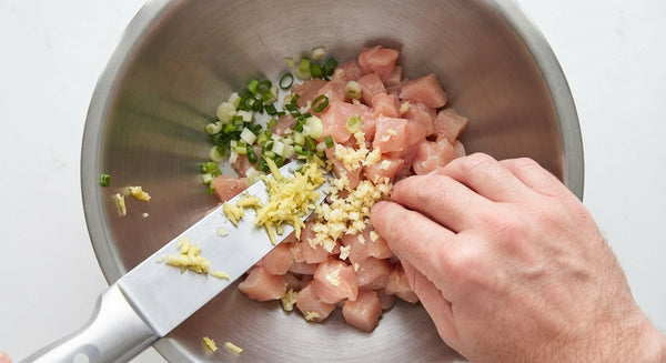 Top with fresh basil, chili flakes, green onions, and crushed peanuts. Serve over warm rice.