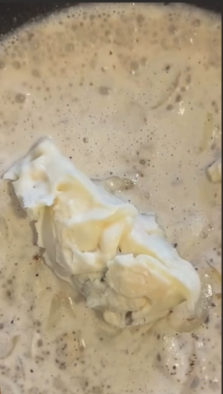 Assemble like a chef. Place the tender cabbage steak on a serving plate. Pour warm blue cheese sauce generously over the top, and sprinkle with toasted buttered nut crunch. Serve immediately.
