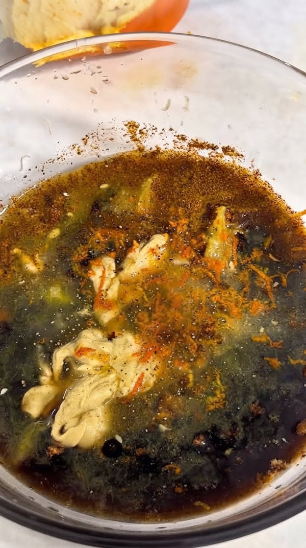 Cover with foil and bake at 200°C (400°F) for 45 minutes. Remove foil and bake uncovered for another 25-30 minutes until skin is crispy and browned.
