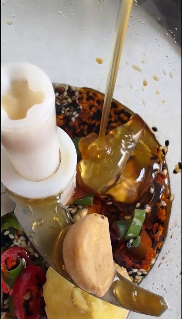 Arrange over steamed Bok Choy, top with toasted sesame seeds and crispy onions, and serve with dipping sauce.