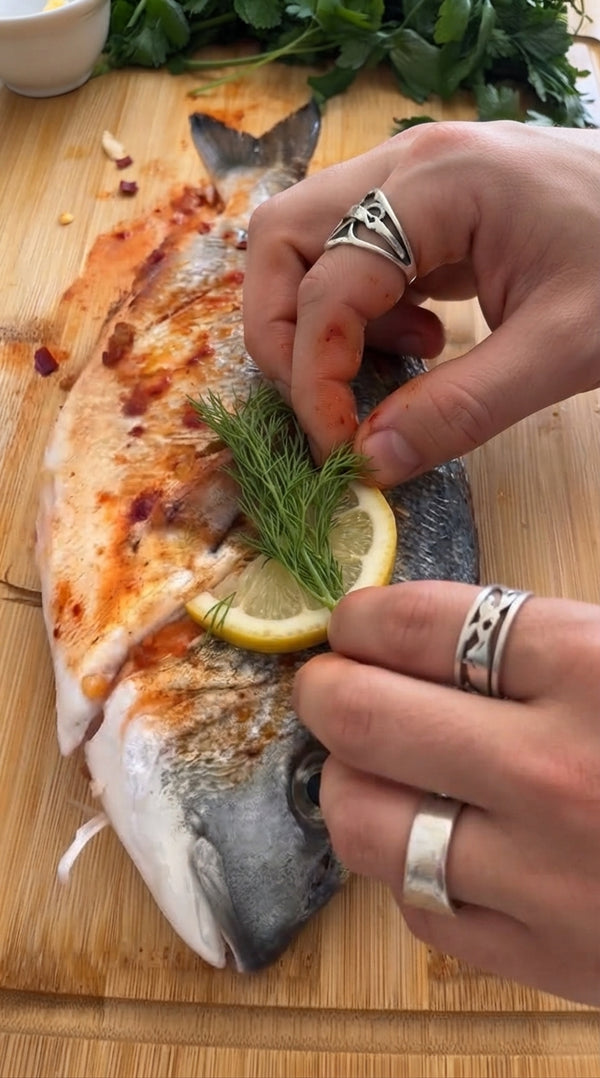 Place fish directly on grill grate. Close lid and grill for 10 minutes total (flip gently at 5 minutes) until skin is charcoal-crispy and meat is juicy and flaky.