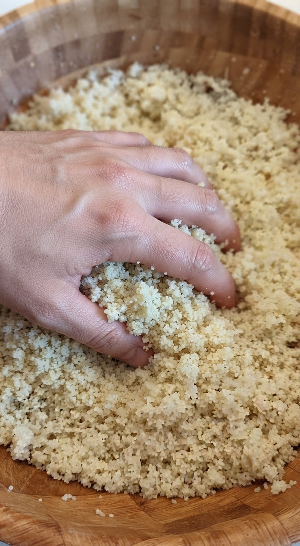 Creates authentic feather-light texture. Transfer hot couscous into a traditional couscous sieve (napa / sifta) and rub through using your hands or a spoon to create separate, ultra-fluffy grains. Serve warm with rich vegetable soup or meatballs.