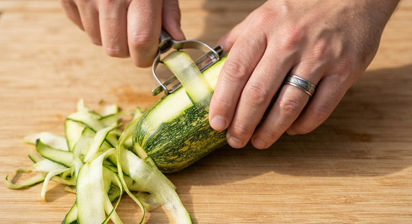 Toss the julienned zucchini strips directly into the simmering Bolognese sauce. Cook for exactly 2 minutes—just enough to warm through while maintaining a crisp, al dente texture.