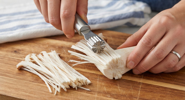 Slice King Oyster mushrooms into thick, juicy bite-sized rounds or scoring strips. In a bowl, whisk soy sauce, sriracha, sesame oil, maple syrup, garlic, and ginger.