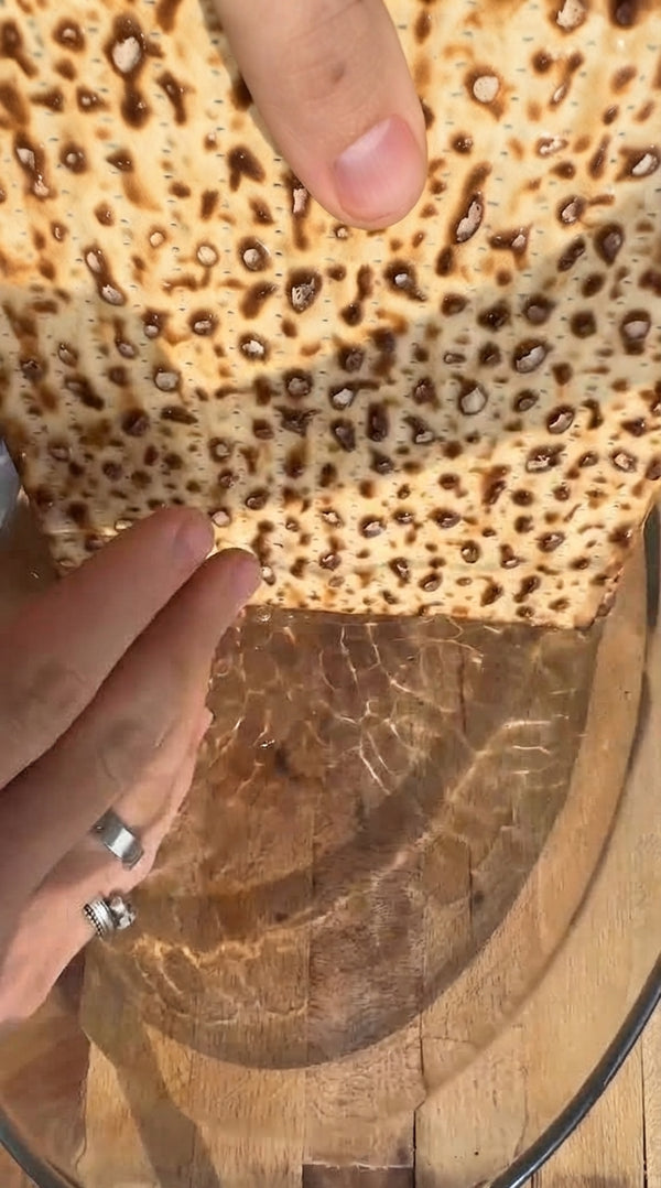 Quickly dip matzah sheets in warm water for 10-15 seconds, then wrap in a towel for 5 minutes until pliable.