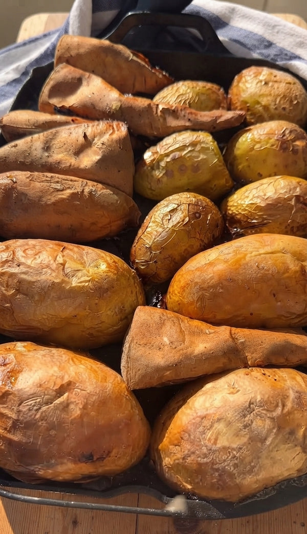 Place the drained potatoes and sweet potatoes in a large bowl. Drizzle generously with olive oil. Sprinkle cornstarch, paprika, garlic powder, oregano, coarse salt, and black pepper. Toss vigorously until every piece is evenly coated.