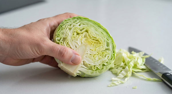 Trim the stem of the cabbage. Boil whole in hot water for 8–10 minutes until leaves soften and separate easily.