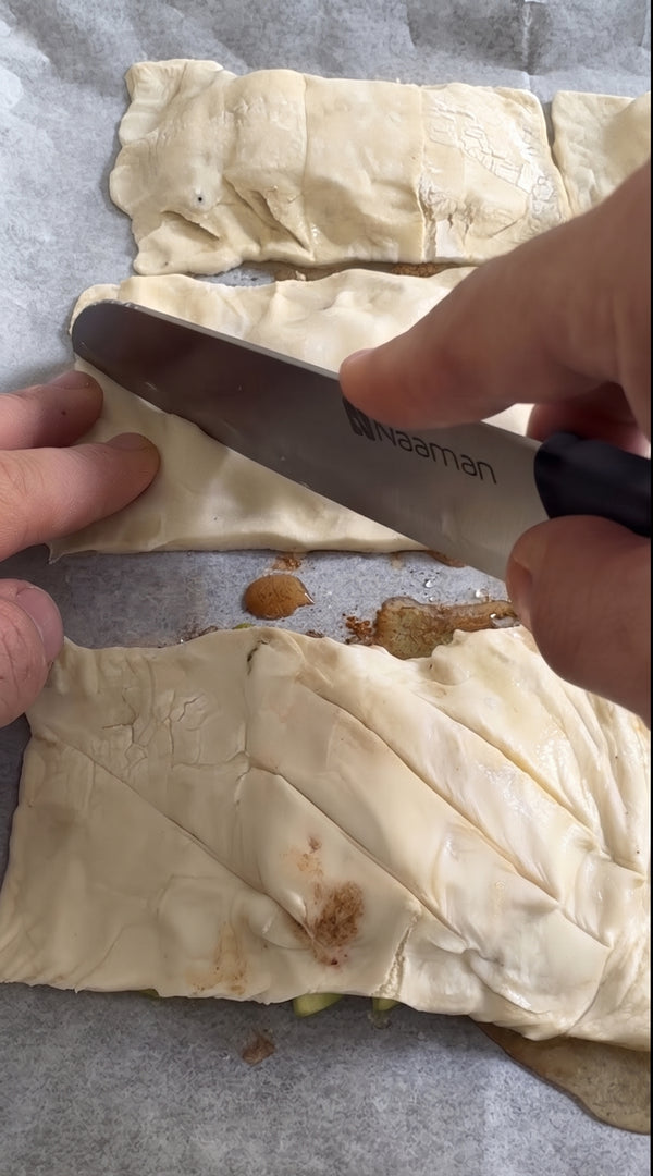 Line a baking sheet with parchment paper. Drizzle small rectangular pools of honey (or silan) and top each with a bit of butter.