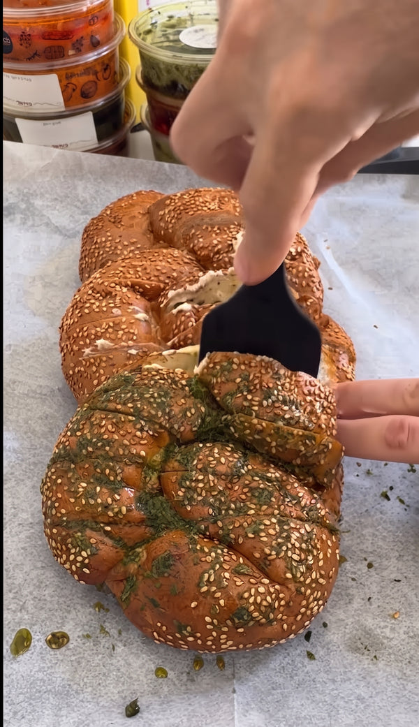 Score the leftover challah diagonally in both directions to create a crosshatch grid pattern, taking care not to cut through the bottom crust.