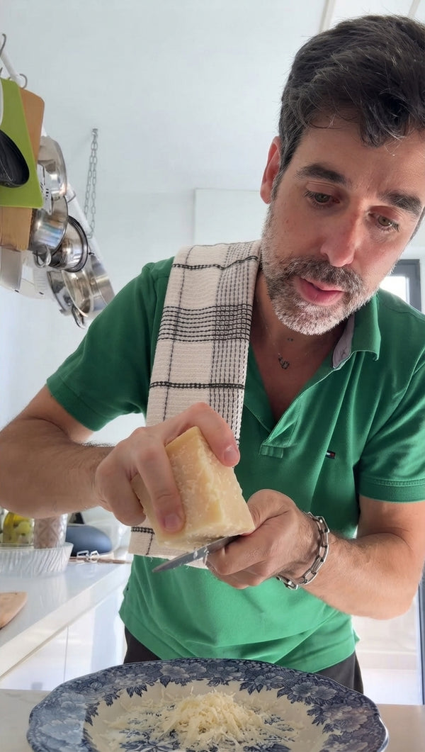 In a small bowl, mix finely grated Pecorino Romano cheese with a few tablespoons of hot water to form a smooth, thick paste.